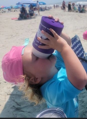 Child enjoying Italian ice on a sunny day